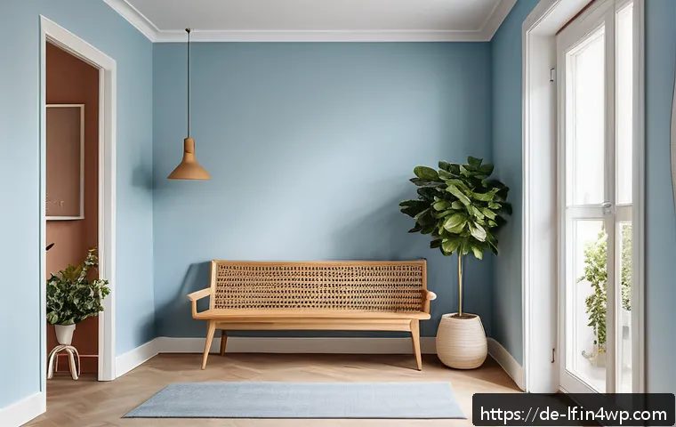 공간 활용도와 색상 배치의 관계 - A cozy small hallway interior painted in soft pastel blue tones, featuring walls, ceiling, and floor...